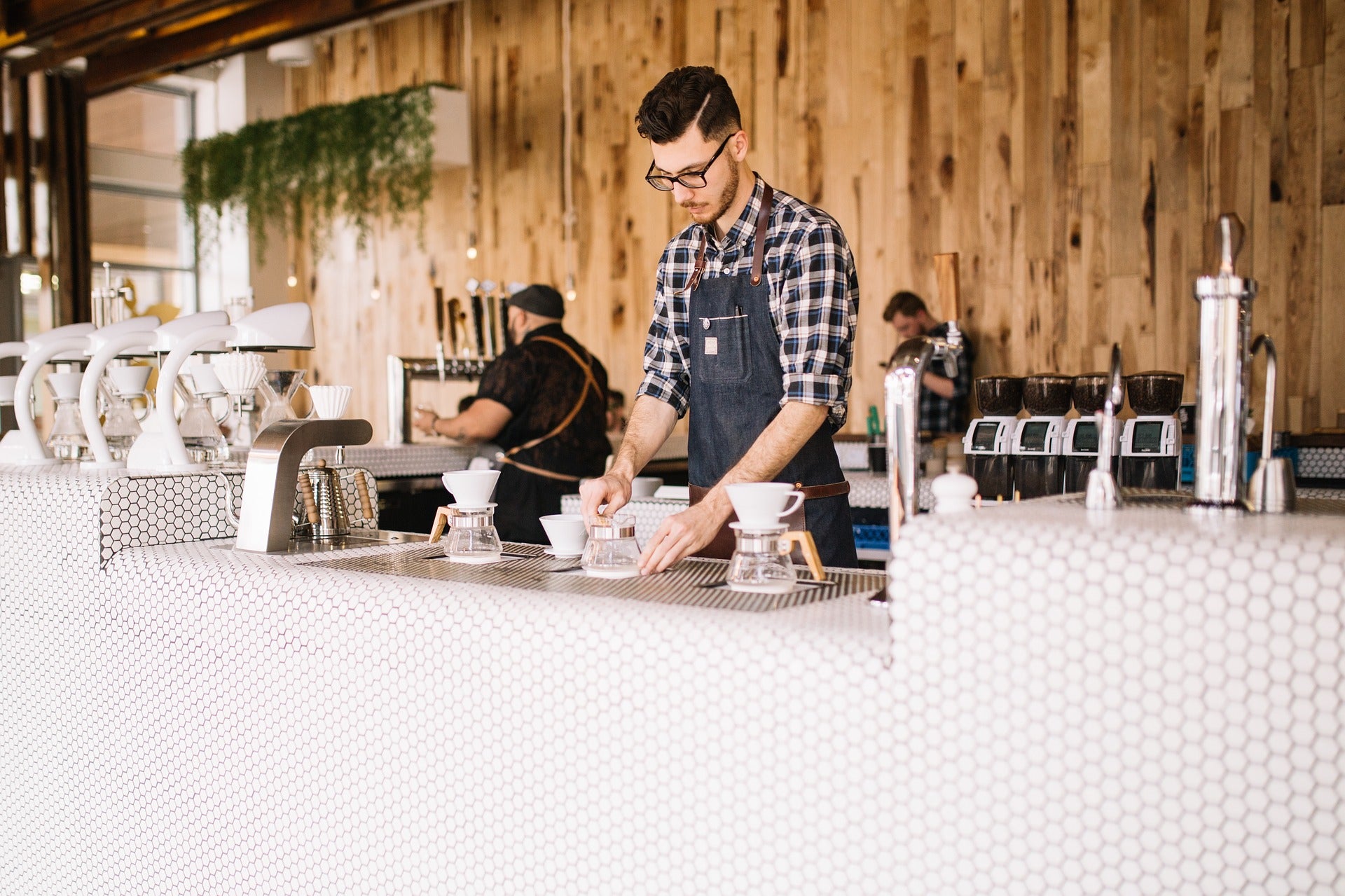 baristas working at a modern coffee shop