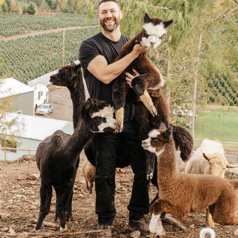 Lee Asher with llamas at The Asher House
