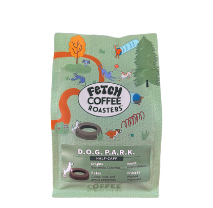Half caffeine coffee. Blend of decaffeinated Colombia and full caffeinated Guatemala. In a green bag with a dog park scene, a green label with a dog racing toward a ball. $1 from each bag sold helps dogs in need.