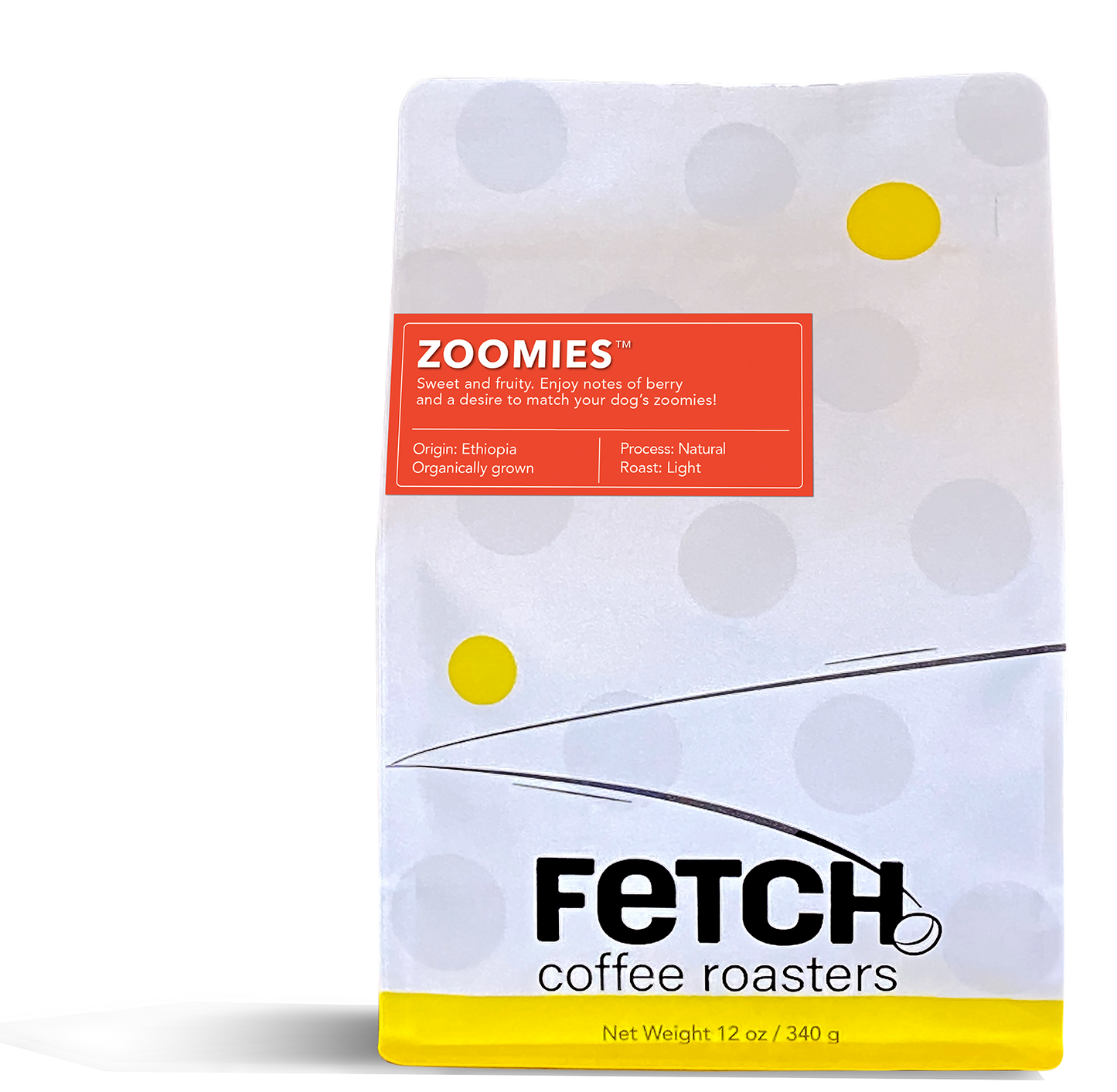 Zoomies has a red-orange label offset to the left and toward the top of the white reclosable coffee bag. The bottom of the bag has a yellow band, and the logo shows a bean sitting at the base of the 'h' of the word Fetch.